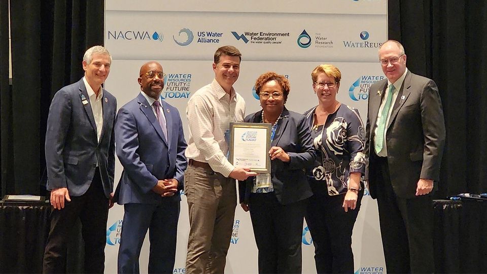 Charlotte Water leadership staff pose with the Utility of the Future Today award