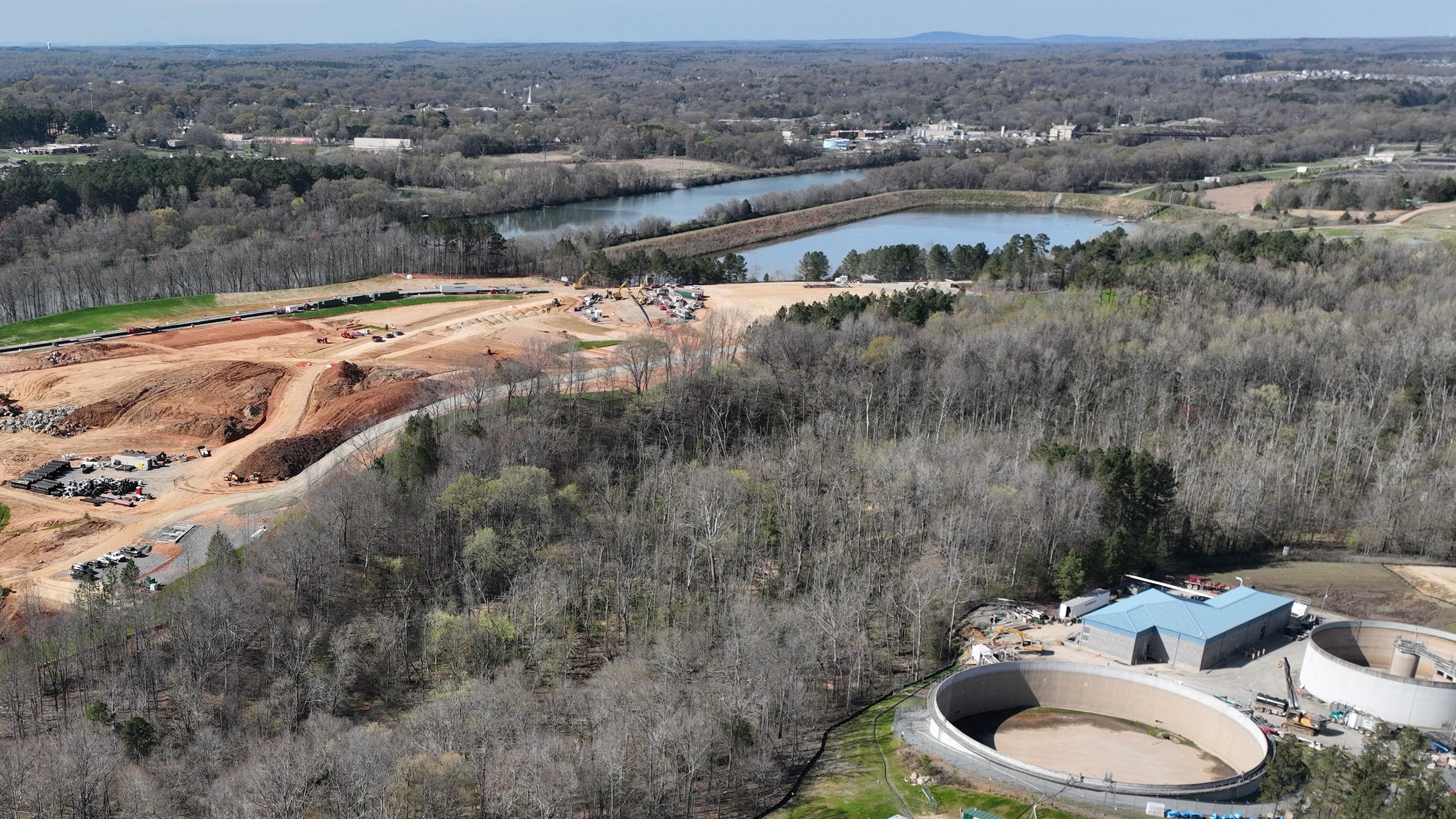 aerial photo of the Long Creek Pump Station and the new Stowe Facility construction sites, separated by a creek and tree buffers