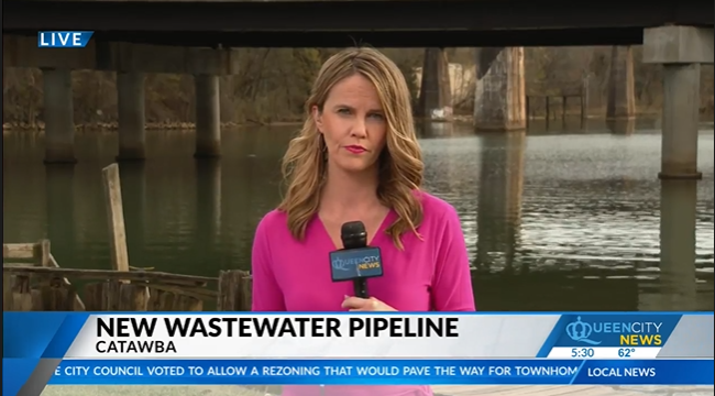 Reporter Robin Kanaday stands in front of the Catawba River reporting on the headline "New Wastewater Pipeline"