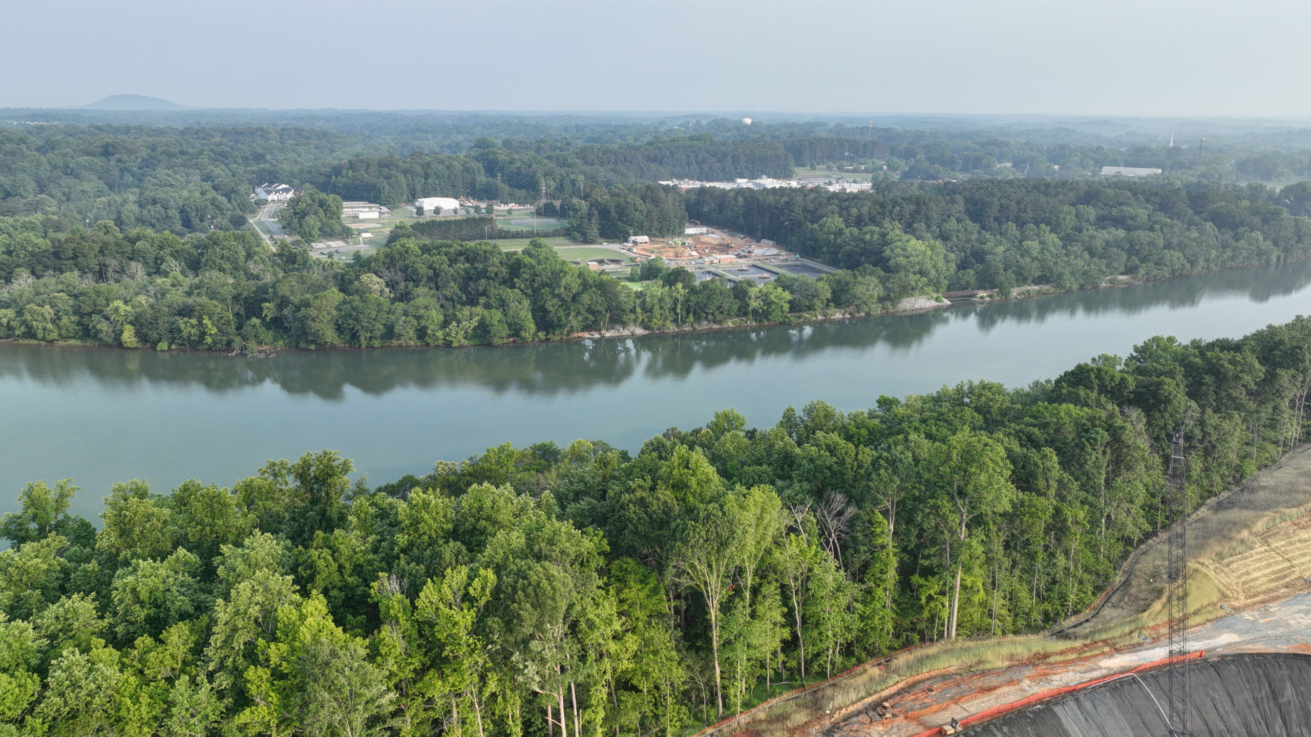 Catawba River surrounded by forests and Stowe Regional Water Resource Recovery Facility construction site