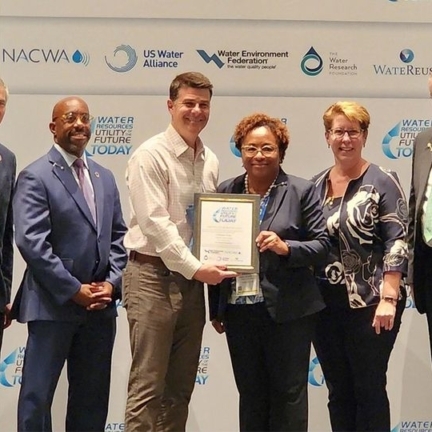Charlotte Water leadership staff pose with the Utility of the Future Today award